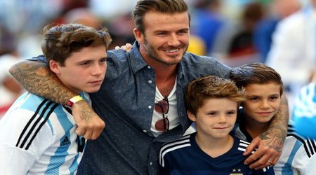 Beckham and sons showing their allegiances at the Maracana