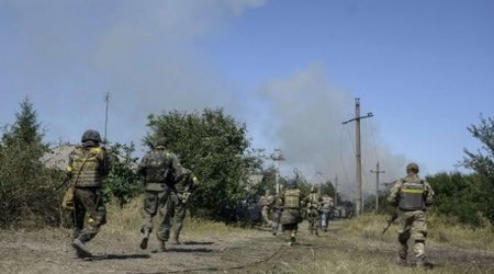 Ukraine leader says Russian forces are in the country as key town falls