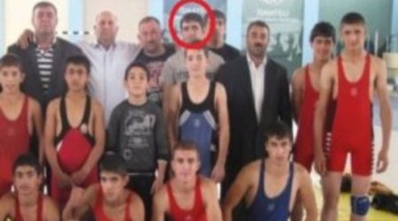Why did an Azerbaijani wrestling champion join IS?