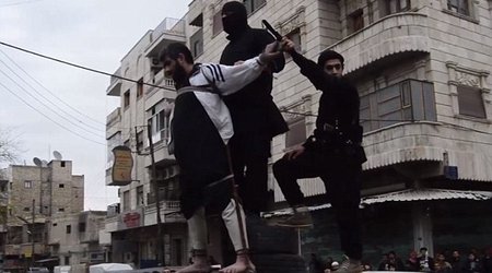 ISIS release horrific photos of a man having his hand amputated for theft