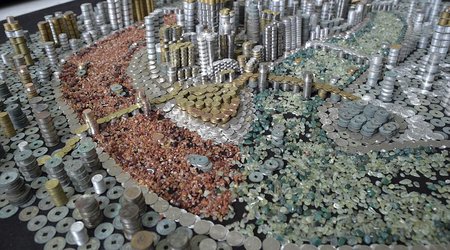 Man painstakingly stacks up 50,000 coins to create a spectacular model of his hometown
