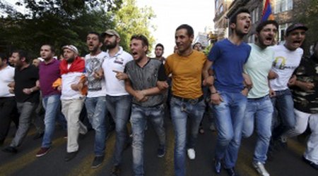 Armenians resume energy price protests, defying police
