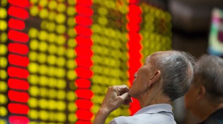Mainland Chinese shares stop trading after 7% plunge
