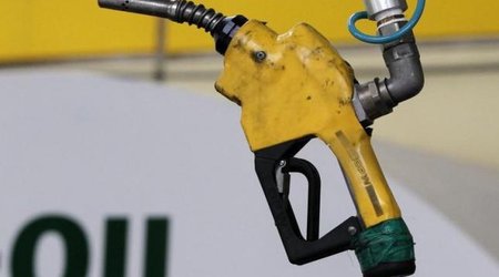 Oil edges down, pares Friday's jump of over 10 percent