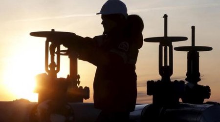Brent edges higher, but U.S. oil down on stock build
