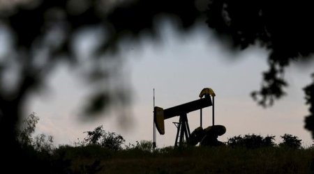 Oil rises as IEA expects biggest non-OPEC output fall in 25 years