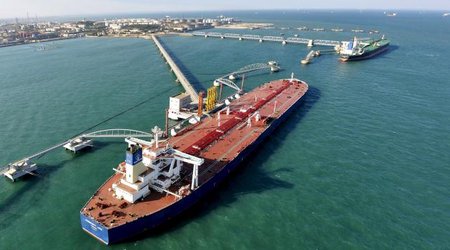 Oil futures rise on weaker dollar, new cash inflows