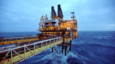 Oil drops on surging dollar, rising U.S. crude stocks, jump in Iran exports