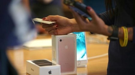 Apple's holiday surprise: big sales, not so big profits
