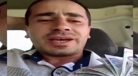 Azərbaycanda: Yüz manatlarla tərini silib, yerə atdı - VİDEO