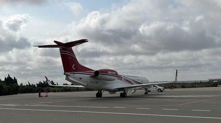 Binali Yildirim, Shamil Ayrim, and security guard seen off to Turkiye
