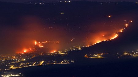 Fires rage in northern Israel after rocket attacks; key roads closed off