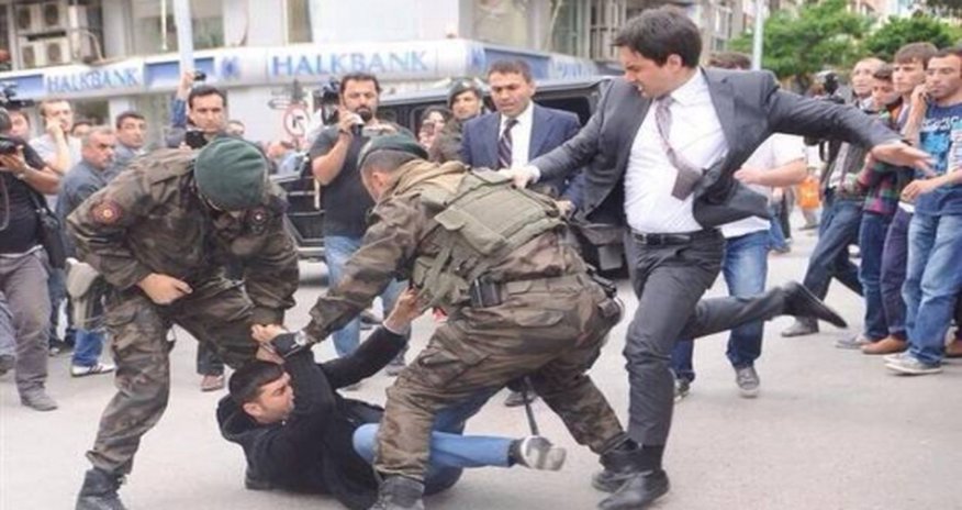 Turkish Prime Minister kicking one of the relatives of a dead miner, who was protesting Turkish Prime Minister kicking one of the relatives of a dead miner, who was protesting