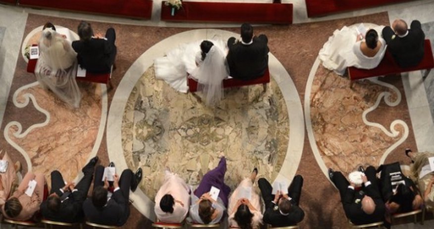 Pope marries 20 cohabiting couples in sign of papacy shift Pope marries 20 cohabiting couples in sign of papacy shift
