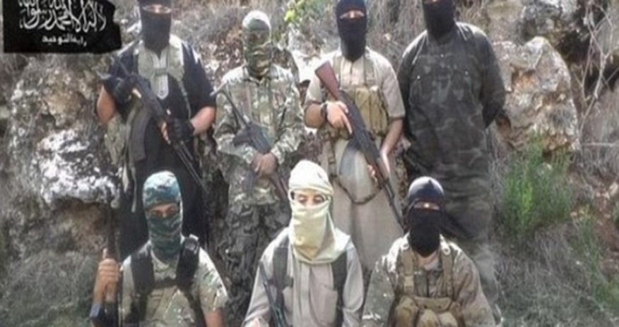 Seven British jihadis photographed in terror picture holding AK47 Seven British jihadis photographed in terror picture holding AK47