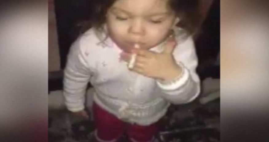 Frightening footage of toddler girl puffing on a cigarette - VIDEO Frightening footage of toddler girl puffing on a cigarette - VIDEO