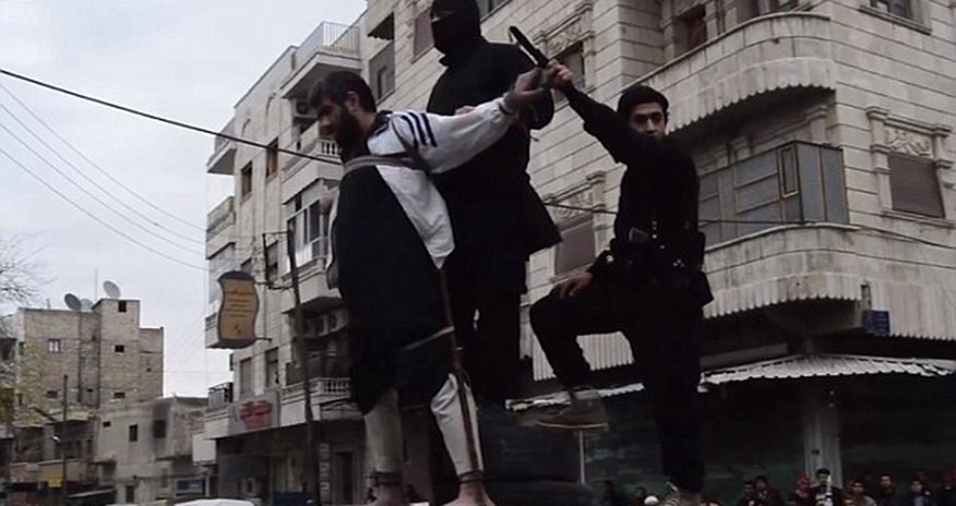 ISIS release horrific photos of a man having his hand amputated for theft ISIS release horrific photos of a man having his hand amputated for theft