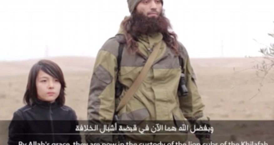 ISIS release new footage claiming to show a child executing two Russian 'spies' ISIS release new footage claiming to show a child executing two Russian 'spies'