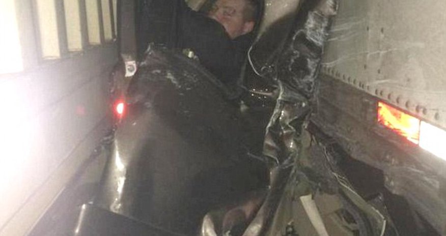 Pictured in mangled wreckage that saved his life Pictured in mangled wreckage that saved his life