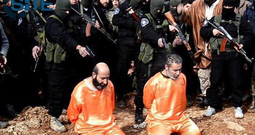 ISIS publicly executes two 'spies' and CRUCIFIES another ISIS publicly executes two 'spies' and CRUCIFIES another