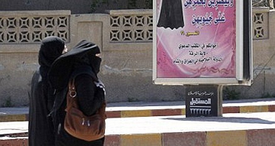 ISIS morality police arrest a woman wearing full burkha and face veil ISIS morality police arrest a woman wearing full burkha and face veil