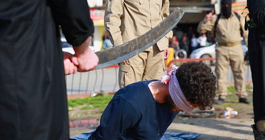 Three men are beheaded with blood-covered sword by ISIS Three men are beheaded with blood-covered sword by ISIS