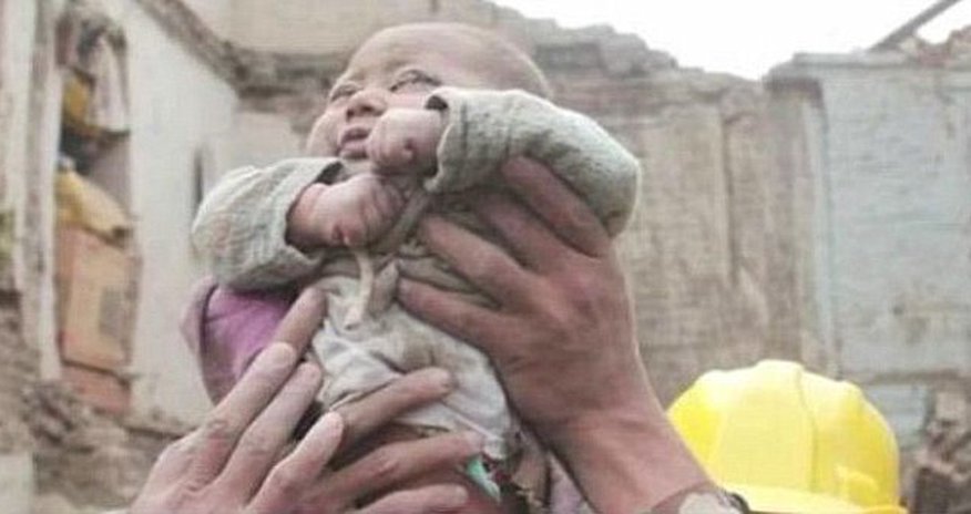 Incredible moment four-month-old baby is pulled ALIVE from the rubble Incredible moment four-month-old baby is pulled ALIVE from the rubble