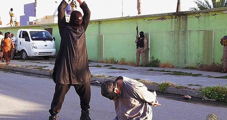 ISIS executioners behead three men accused spying for the government ISIS executioners behead three men accused spying for the government