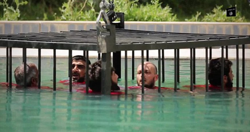 Sickening new ISIS video shows caged prisoners Sickening new ISIS video shows caged prisoners