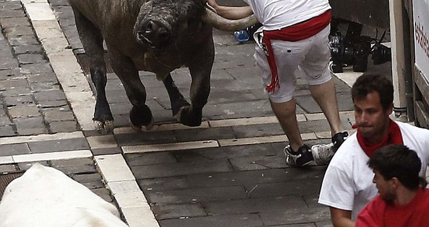 Runner is gored by a bull during the annual festival in Pamplona Runner is gored by a bull during the annual festival in Pamplona