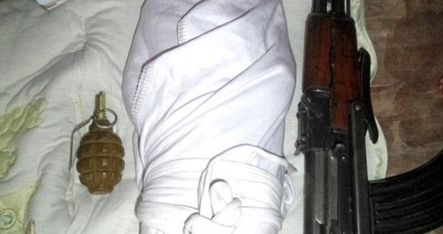 Baby jihadis: Tiny child pictured next to a gun is the face of a new wave of ISIS recruitment Baby jihadis: Tiny child pictured next to a gun is the face of a new wave of ISIS recruitment