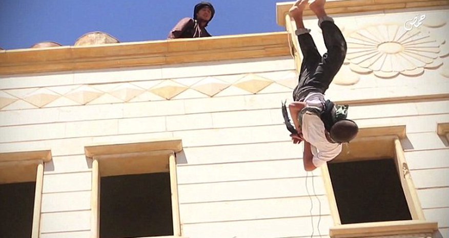 Two gay men are thrown off tall building by ISIS Two gay men are thrown off tall building by ISIS