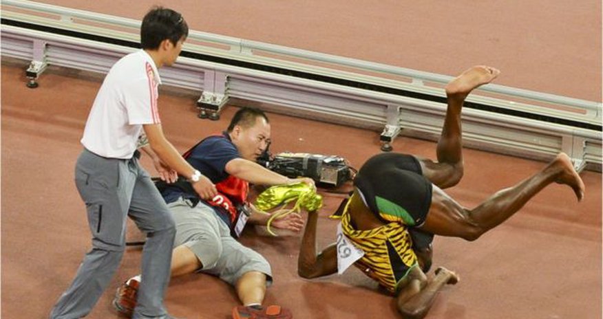 Usain Bolt knocked down in Beijing - in pictures Usain Bolt knocked down in Beijing - in pictures
