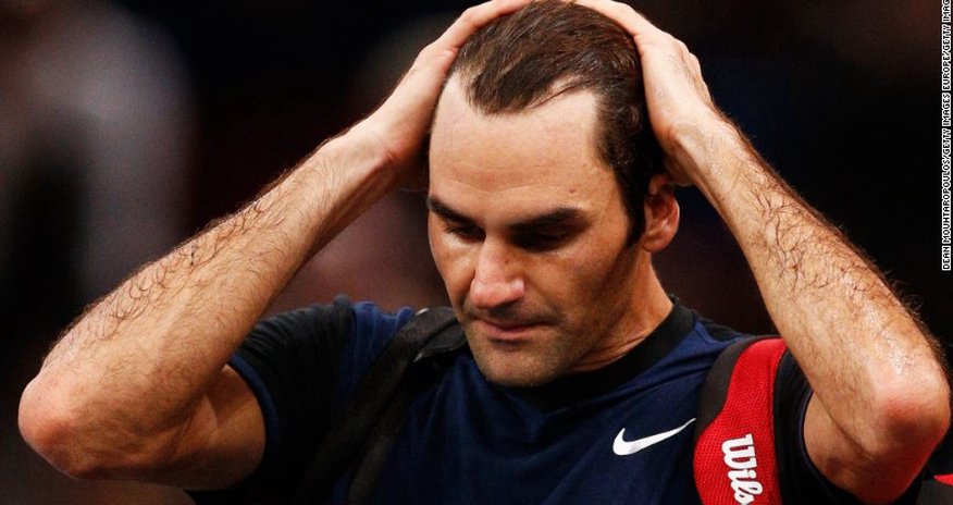 Roger Federer knocked out in Paris by John Isner's power Roger Federer knocked out in Paris by John Isner's power