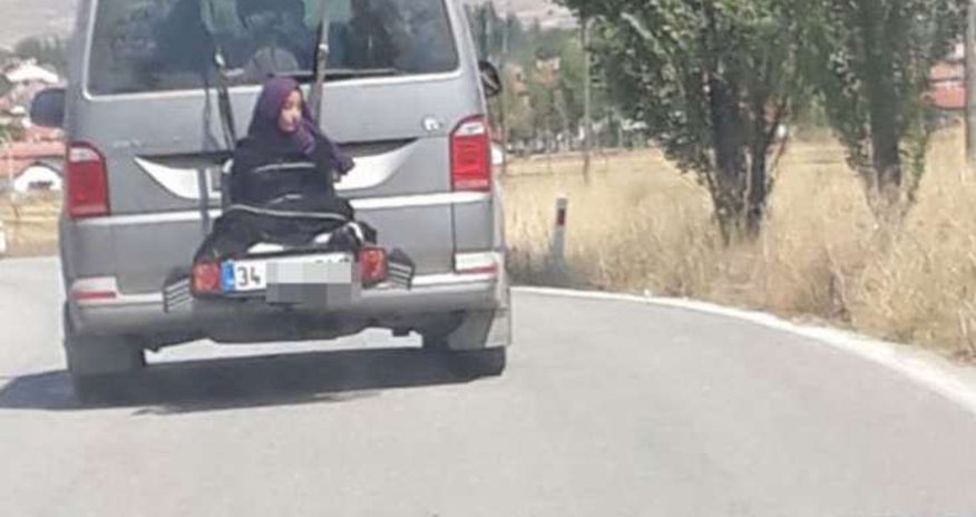 Qızı yük kimi avtobusun arxasına bağlayıb... - VIDEO Qızı yük kimi avtobusun arxasına bağlayıb... - VIDEO