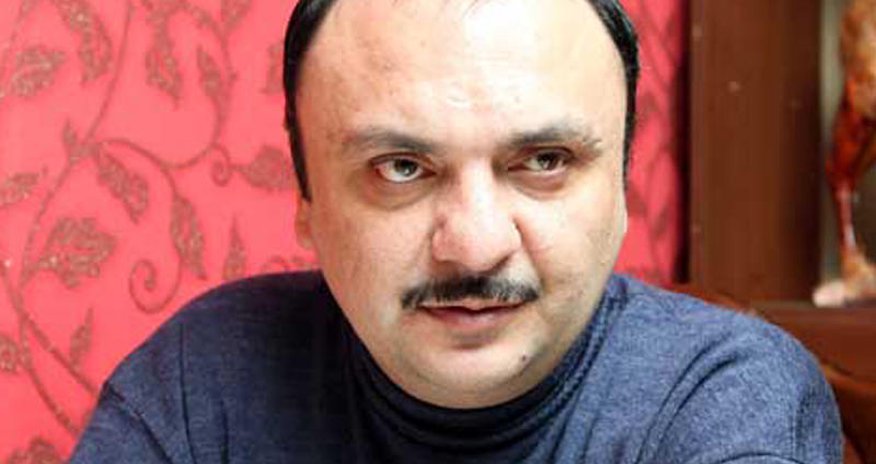 Anar Nağılbazın qəbrini su basdı Anar Nağılbazın qəbrini su basdı