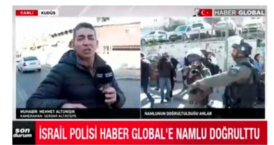 Israeli police point gun at employees of Haber Global in Al-Quds Israeli police point gun at employees of Haber Global in Al-Quds